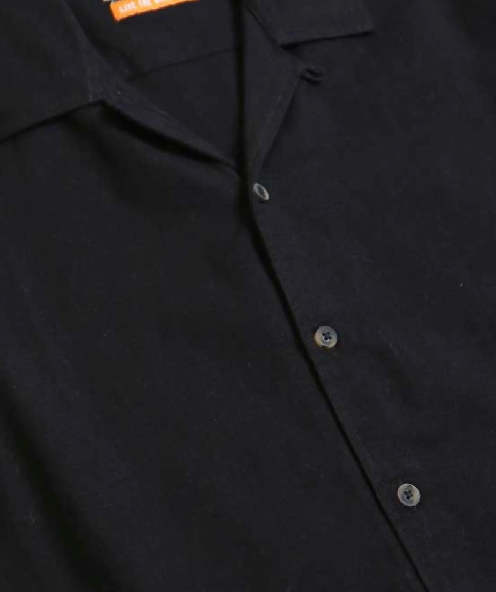 The Quintessential Black Button-Up Shirt